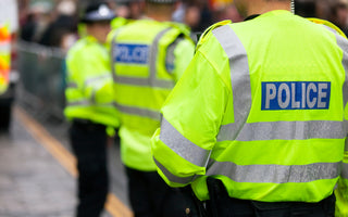 Three police officers standing.